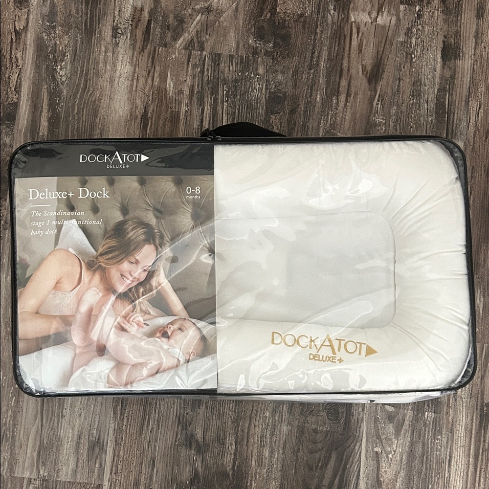 Brand New, never opened and never used, Dock A Tot Deluxe+ in Pristine White
